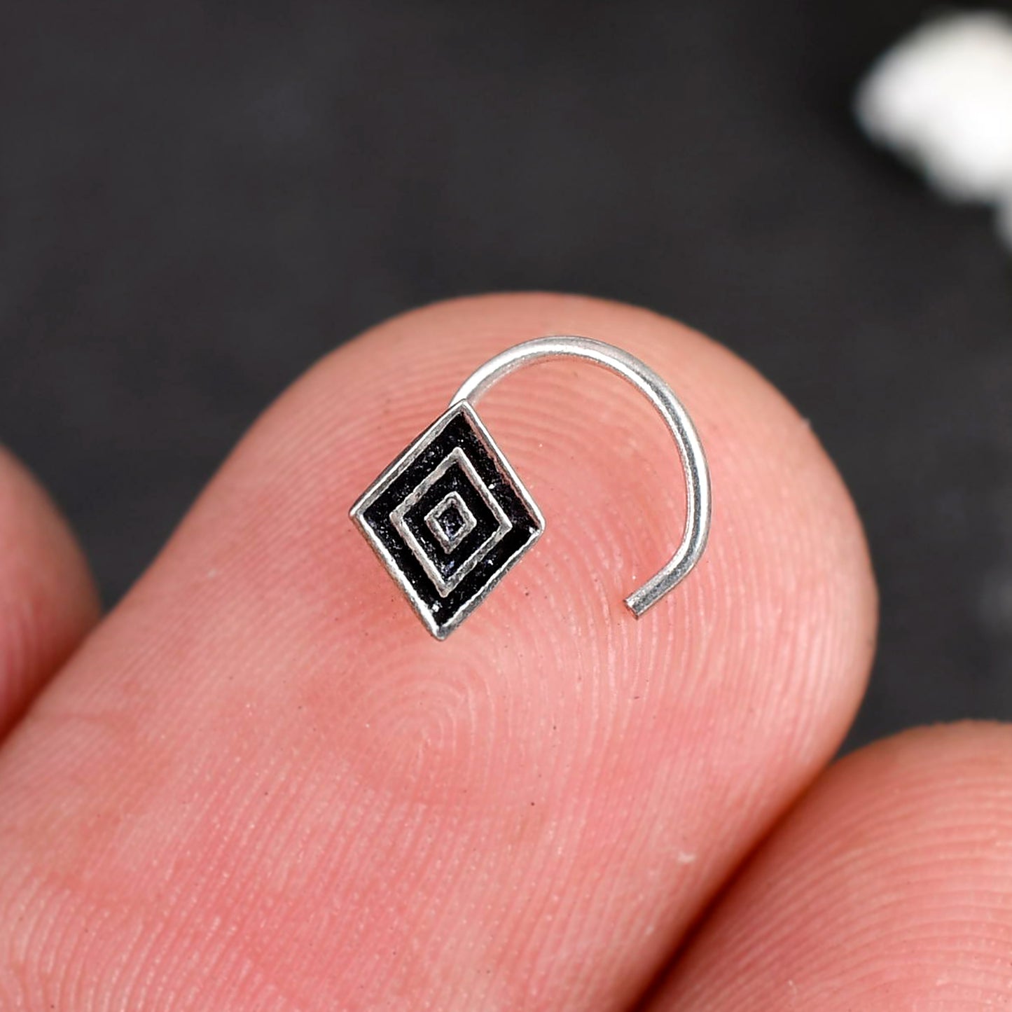 silver nose stud